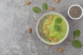 Breakfast Detox Green Smoothie from Banana, Spinach, chia seeds and almonds in the Bowl. Concept of diet and healthy eating. Royalty Free Stock Photo