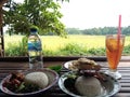 breakfast at the edge of rice field Royalty Free Stock Photo