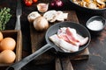 Breakfast egg ingredients, on old dark  wooden table background Royalty Free Stock Photo