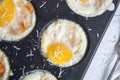 Breakfast eggs baked in cake mold with ground parmesan Royalty Free Stock Photo