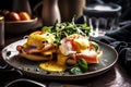 A breakfast of eggs benedict with crusty sourdough bread.