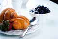 Breakfast with eggs, fresh croissants,