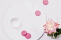 Before Breakfast. Empty glass and pink french cookies macaroons and rose flower