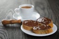 Breakfast with espresso and baguette slices with chocolate spread Royalty Free Stock Photo
