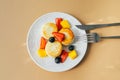 Breakfast food concept. Cottage cheese pancakes on plate. Syrniki with berry, top view Royalty Free Stock Photo