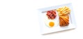 Breakfast food fresh and tasty croissant dessert , potato french fried, fried egg and fried bacon in white plate Royalty Free Stock Photo