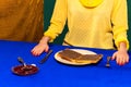 Food pop art photography. Cropped portrait of girl and sweet chocolate toasts on blue tablecloth. Vintage, retro style Royalty Free Stock Photo