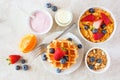 Breakfast food table scene. Fruits, cereal, waffles, yogurt and milk. Top view over a bright background. Royalty Free Stock Photo
