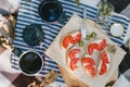 Breakfast in a forest with bruschetta with feta cheese, tomatoes and olives