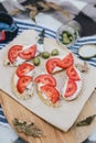 Breakfast in a forest with bruschetta with feta cheese, tomatoes and olives