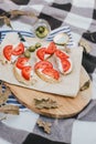 Breakfast in a forest with bruschetta with feta cheese, tomatoes and olives