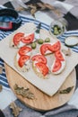 Breakfast in a forest with bruschetta with feta cheese, tomatoes and olives