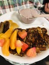 French toast sticks with peaches, strawberries, sausage, and smoothie yogurt