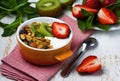 Breakfast with fresh Greek yogurt, strawberries, kiwi and grano