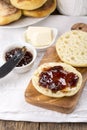 Breakfast. Fresh homemade English muffins with butter and jam