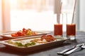 Breakfast from fried egg, bacon, vegetable salad and carrot juice. On a dark stone background Royalty Free Stock Photo