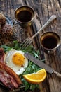 Breakfast with fried egg and becon in rustic stile Royalty Free Stock Photo