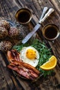 Breakfast with fried egg and becon in rustic stile Royalty Free Stock Photo