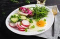 Fried egg, fresh vegetable salad and lard sandwich. Keto diet Royalty Free Stock Photo