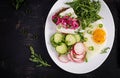 Fried egg, fresh vegetable salad and lard sandwich. Keto diet. Top view Royalty Free Stock Photo