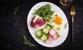 Fried egg, fresh vegetable salad and lard sandwich. Keto diet. Top view Royalty Free Stock Photo