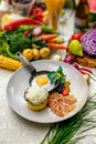 Breakfast, fried egg in a frying pan with tender slices of bacon and mashed potatoes with cheese Royalty Free Stock Photo