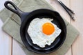 Breakfast the fried egg in a iron frying pan Royalty Free Stock Photo