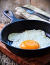 Breakfast the fried egg in a iron frying pan Royalty Free Stock Photo