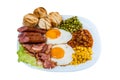 breakfast fried egg peas, corn grains, beans fried sausages and fried bacon on a white plate