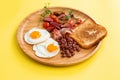 Breakfast fried eggs, bacon, beans and toast Royalty Free Stock Photo