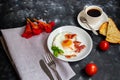 Breakfast. Fried eggs with bacon decorated with basil leaves. Royalty Free Stock Photo