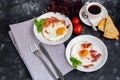 Breakfast. Fried eggs with bacon decorated with basil leaves. Royalty Free Stock Photo