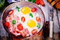 Breakfast with fried eggs, bacon, tomatoes and parsley Royalty Free Stock Photo