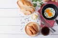 Breakfast with fried eggs on pan and sausage grill with toast, c Royalty Free Stock Photo