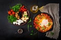 Breakfast. Fried eggs with vegetables - shakshuka in a frying pan Royalty Free Stock Photo