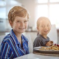 Breakfast fuels you up. a sister and brother having breakfast. Royalty Free Stock Photo