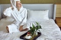 Breakfast. Good Morning. Happy Girl with Breakfast. Home Style Relaxation Woman Wearing Bathrobe and Towel after Shower Royalty Free Stock Photo