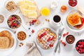 Breakfast with granola berry nuts, waffle, toast, jam, chocolate Royalty Free Stock Photo