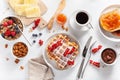 Breakfast granola berry nuts, waffle, toast, jam, chocolate spread and coffee. Top view Royalty Free Stock Photo
