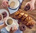 Breakfast. Hands holding cups of coffee. Royalty Free Stock Photo