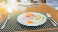 Breakfast has ham, fried egg, salad on a white plate Royalty Free Stock Photo