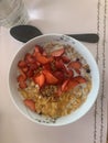 Cereals in bowl, with strawberries