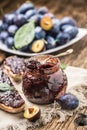 Breakfast from homemade plum jam bread and ripe plums. Royalty Free Stock Photo