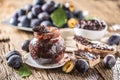 Breakfast from homemade plum jam bread and ripe plums. Royalty Free Stock Photo