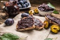 Breakfast from homemade plum jam bread and ripe plums. Royalty Free Stock Photo