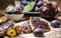 Breakfast from homemade plum jam bread and ripe plums. Royalty Free Stock Photo