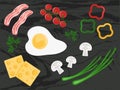 Breakfast ingredients on a black texture background. Designer of dishes from various ingredients. Scrambled eggs, cheese Royalty Free Stock Photo