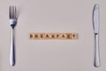 Breakfast inscription from wooden blocks. Royalty Free Stock Photo