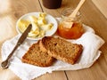 Breakfast with integral toast, butter and apricot jam on wooden table Royalty Free Stock Photo