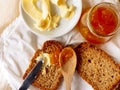 Breakfast with integral toast, butter and apricot jam on wooden table Royalty Free Stock Photo